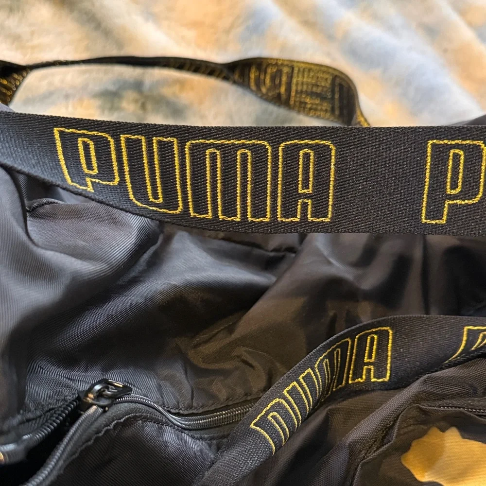 Puma Black Duffel Bag with Gold Puma Logo and Branded Straps